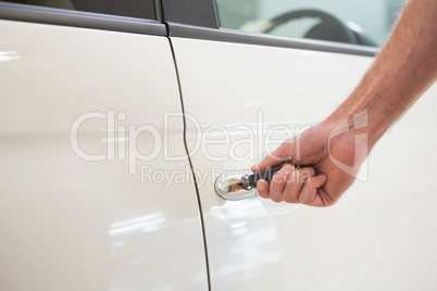 Man opening a car with a key