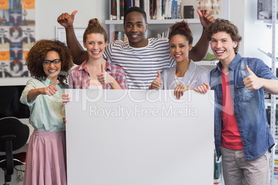 Fashion students smiling at camera together