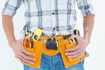 Cropped image of technician with tool belt around waist