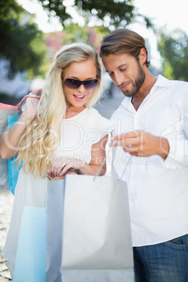 Attractive couple looking at shopping purchases