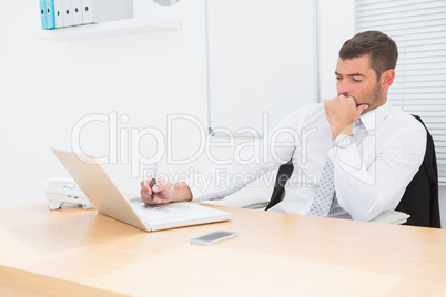 Businessman using his laptop