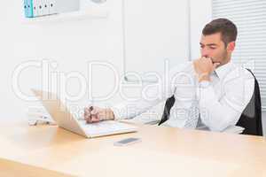 Businessman using his laptop