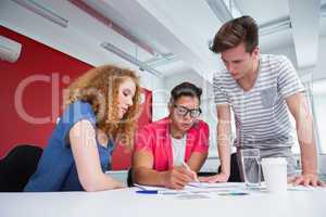 Serious student working and taking notes together