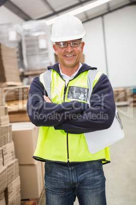 Worker wearing hard hat in warehouse