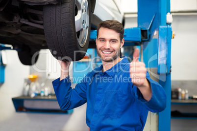 Mechanic adjusting the tire wheel