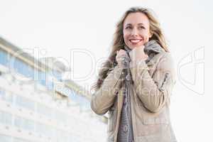 Portrait of smiling blonde in warm clothes