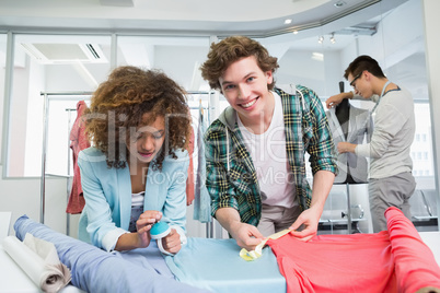 Students working together with a fabric