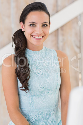 Stylish brunette smiling at camera