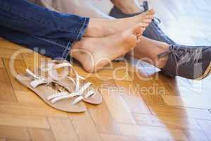 Close up of cute couple sitting on floor