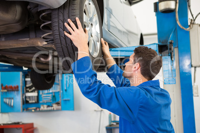 Mechanic adjusting the tire wheel