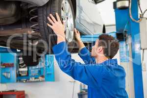 Mechanic adjusting the tire wheel