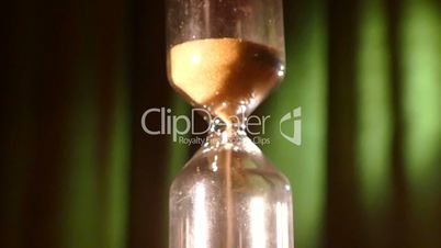 Hourglass on a green background
