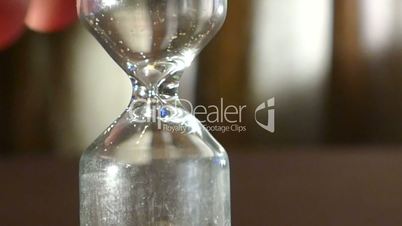 Hourglass on a white background with the coup