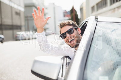 Happy businessman in the drivers seat