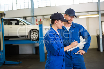 Team of mechanics talking together