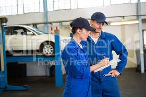 Team of mechanics talking together