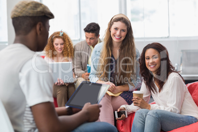 Fashion students smiling at camera together