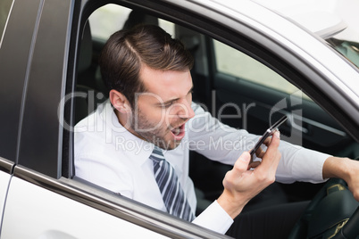 Angry businessman on the phone