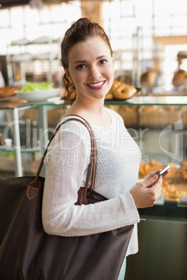 Pretty brunette shopping for bread