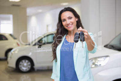 Smiling customer showing her new keys