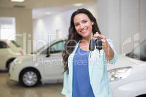 Smiling customer showing her new keys