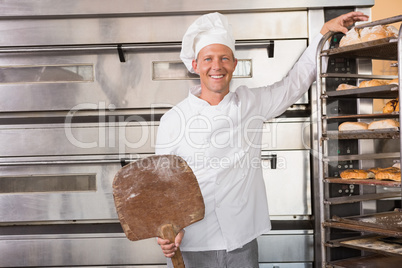 Happy baker smiling at camera