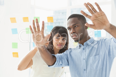 Concentrated coworkers brainstorming with sticky notes