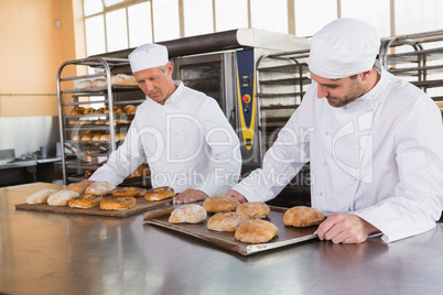 Bakers checking freshly baked bread