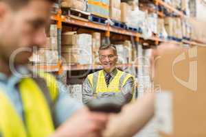 Warehouse worker scanning barcode on box