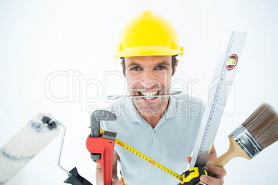 Happy worker with various equipment