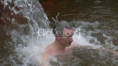 Man Taking Bath in Hot Springs Furnas, Azores, Portugal