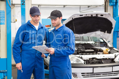 Team of mechanics talking together