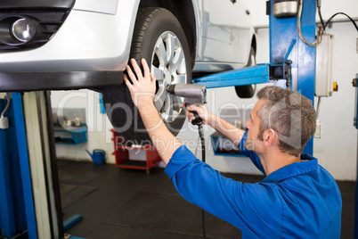 Mechanic adjusting the tire wheel