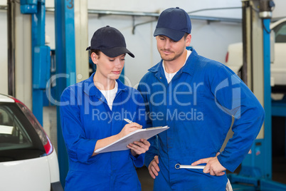 Team of mechanics smiling at camera