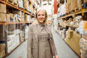 Smiling woman wearing a headset