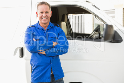 Smiling man in front of delivery van