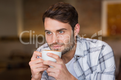 Young man having cup of coffee