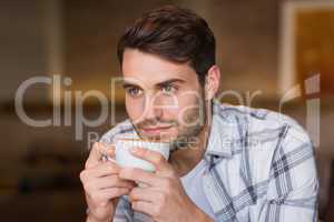 Young man having cup of coffee