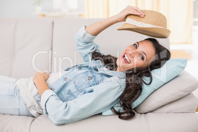 Pretty brunette relaxing on the couch