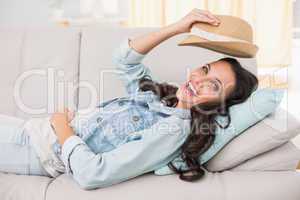 Pretty brunette relaxing on the couch