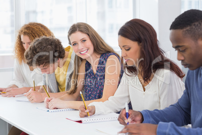 Fashion students being attentive in class