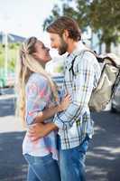 Attractive couple standing and hugging