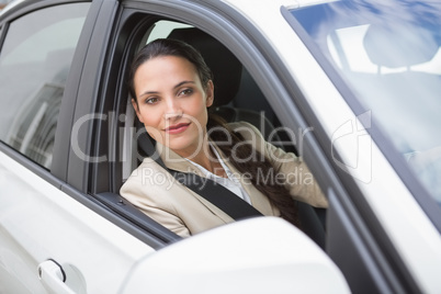 Businesswoman sitting in drivers seat