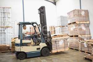 Forklift machine in a large warehouse