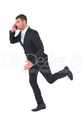 Businessman running on the phone