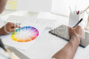Businessman using colour sample and digitizer