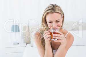 Beautiful blonde enjoying hot beverage