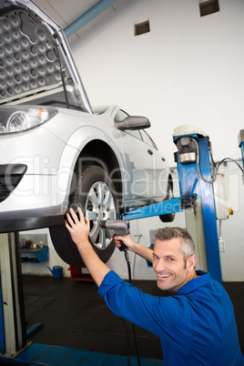 Mechanic adjusting the tire wheel