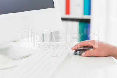 Hand of businessman using mouse of computer