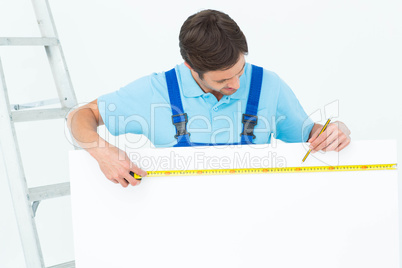 Carpenter measuring blank bill board